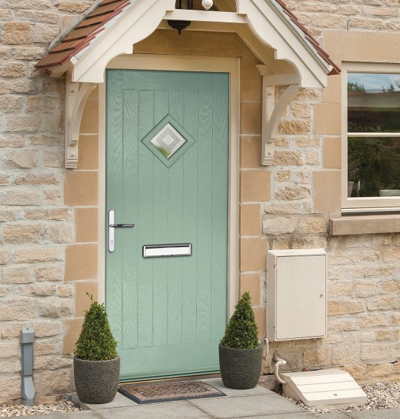 turquoise composite door in stone home