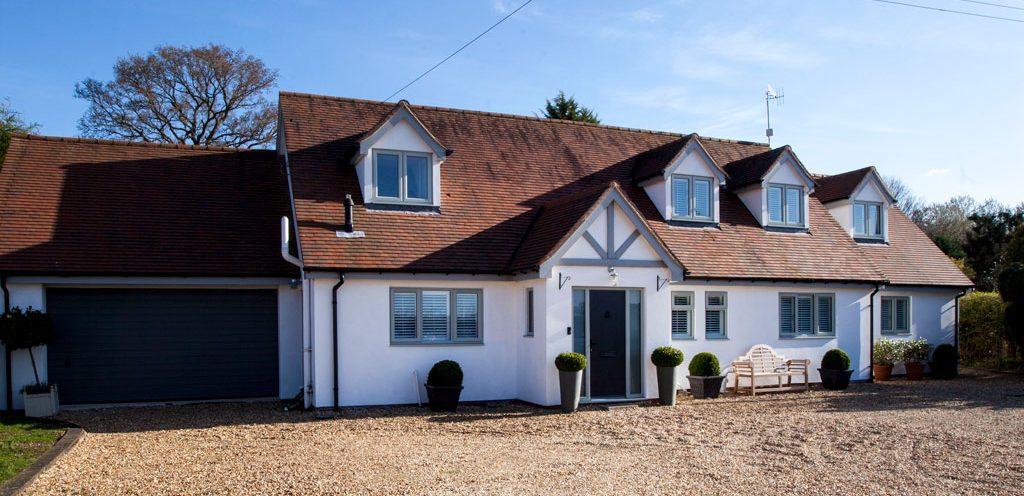 grey uPVC windows on mock Tudor home