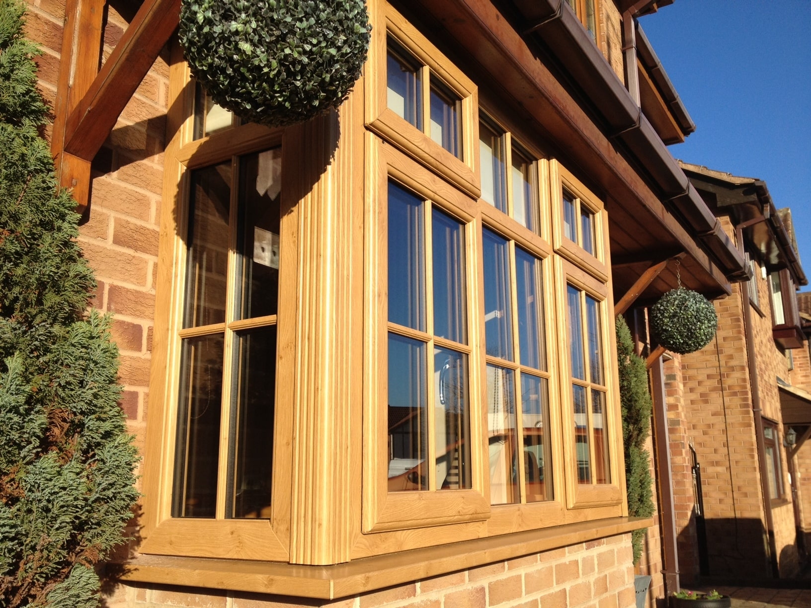 uPVC windows with woodgrain finish in Irish Oak